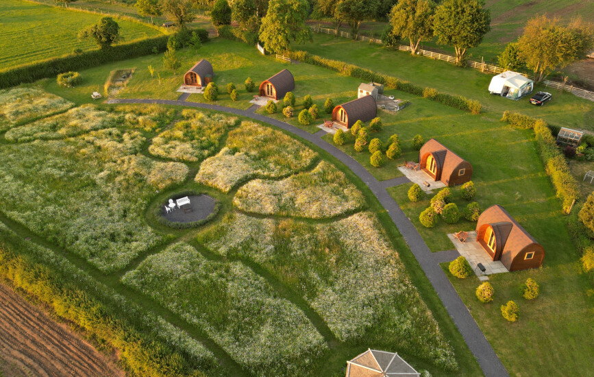 Drone footage of Bradley Hall rural escapes camping lodges